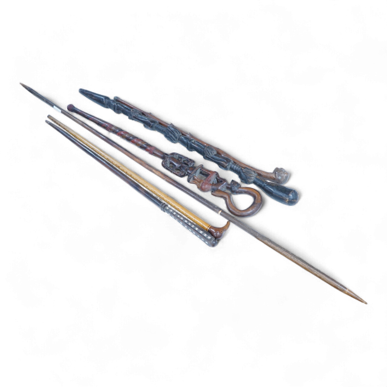 A collection of African and other walking sticks and walking canes - ebonised cane 105 cm long